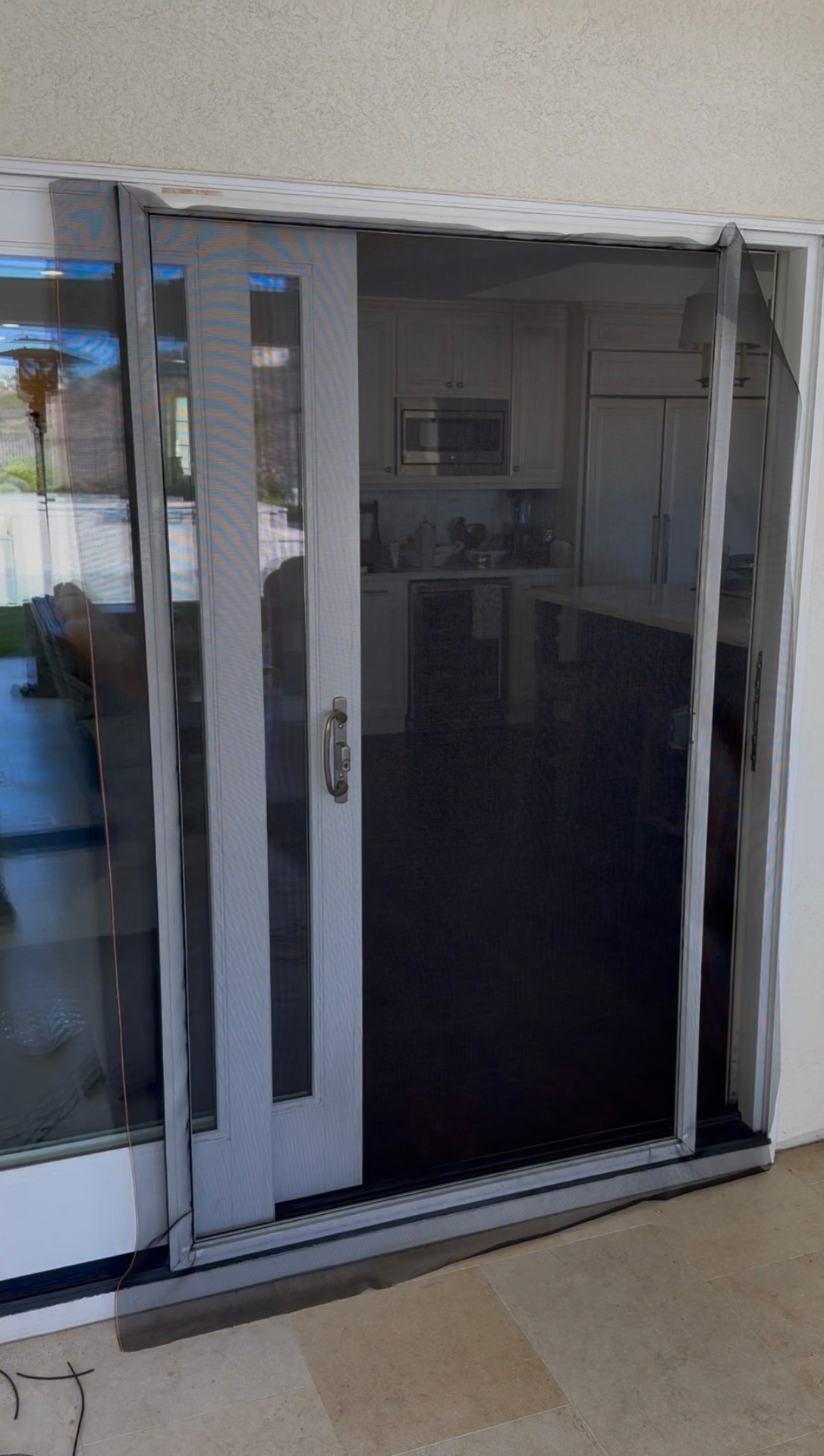 Patio screen door — before repair